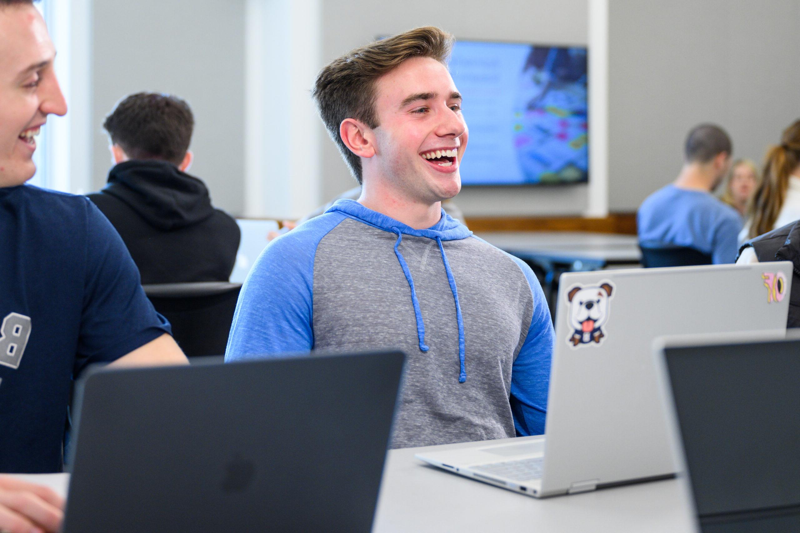 Male 亚博体育 student smiling during class.